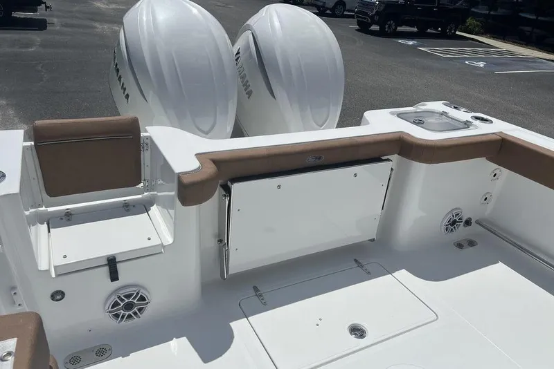 Slide: The Image of 2026 Sea Hunt Gamefish 30 boat with forward seating and twin Yamaha engines. - 25