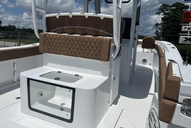Slide: The Image of 2026 Sea Hunt Gamefish 30 Forward Seating boat interior with cushioned seats and storage. - 28
