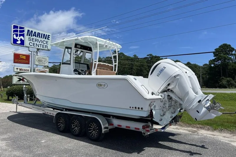 Slide: The Image of 2026 Sea Hunt Gamefish 30 boat on trailer at Marine Service Center. - 3
