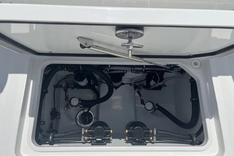 Slide: The Image of 2026 Sea Hunt Gamefish 30 Forward Seating boat compartment with visible mechanical components. - 32