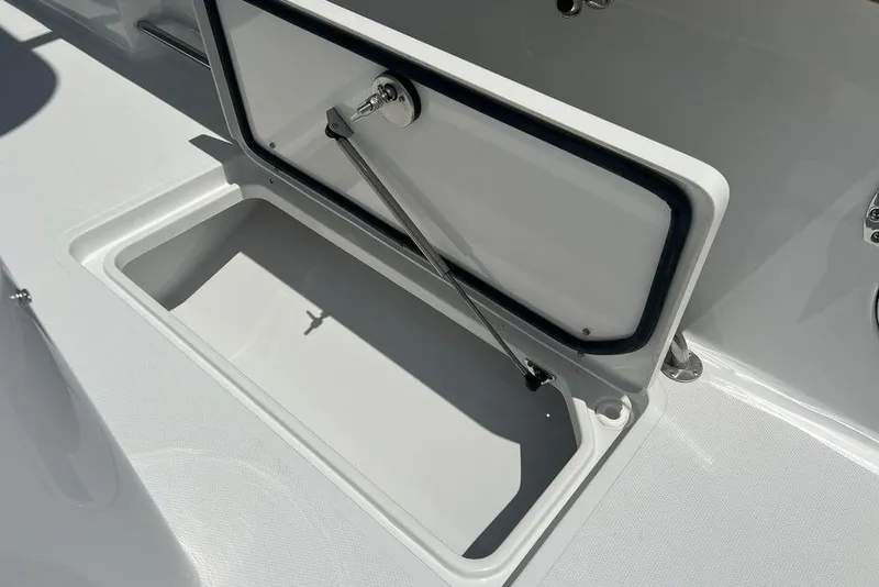 Slide: The Image of Open storage compartment on 2026 Sea Hunt Gamefish 30 Forward Seating boat. - 33