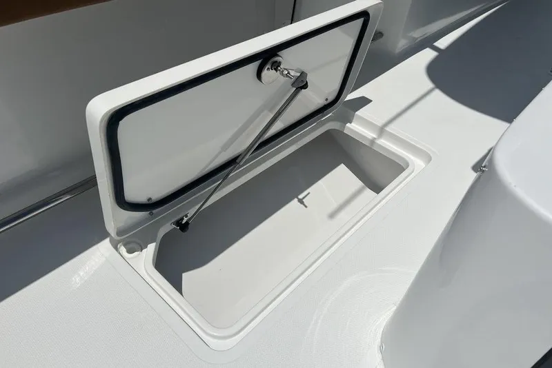 Slide: The Image of Open storage compartment on 2026 Sea Hunt Gamefish 30 Forward Seating boat. - 34