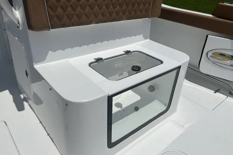 Slide: The Image of 2026 Sea Hunt Gamefish 30 Forward Seating boat interior with storage compartment. - 35