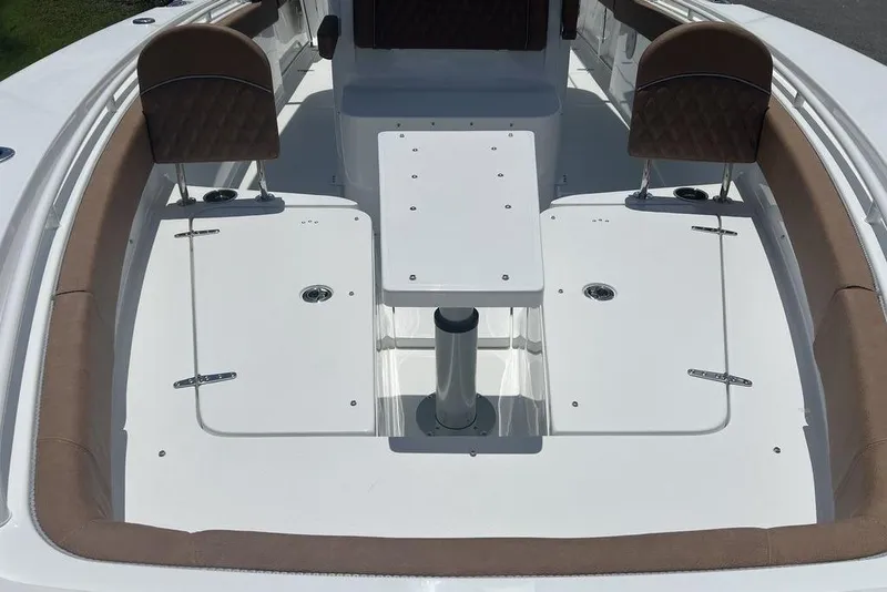 Slide: The Image of 2026 Sea Hunt Gamefish 30 Forward Seating, spacious deck with cushioned seats and storage. - 8