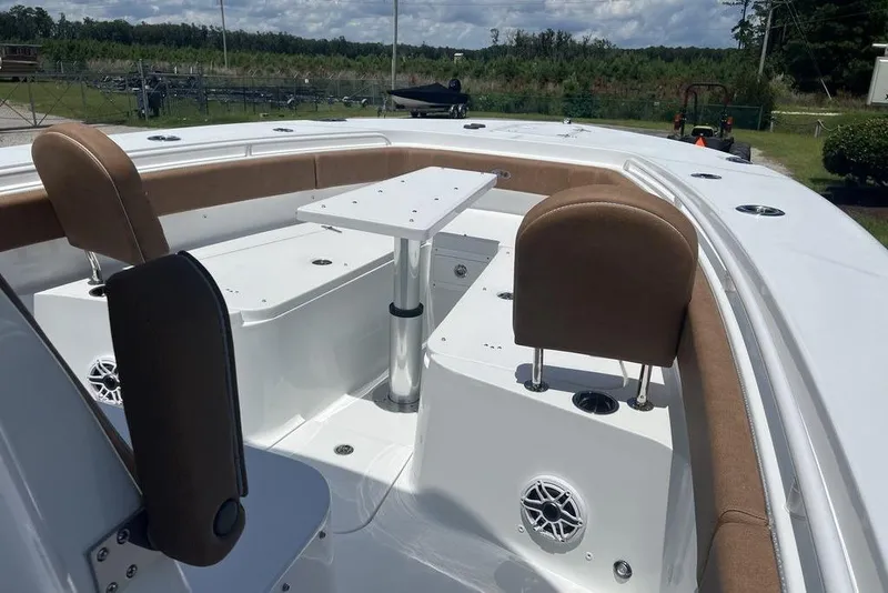 Slide: The Image of 2026 Sea Hunt Gamefish 30 Forward Seating with table and cushioned seats. - 9