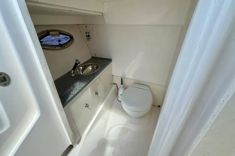 Slide: The Image of 2019 Robalo R317 Dual Console boat bathroom with sink and toilet. - 30