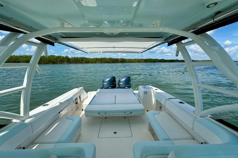 Slide: The Image of 2019 Robalo R317 Dual Console boat interior with scenic water view. - 32