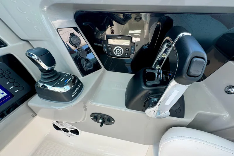 Slide: The Image of 2019 Robalo R317 Dual Console boat controls and dashboard with joystick and throttle. - 34