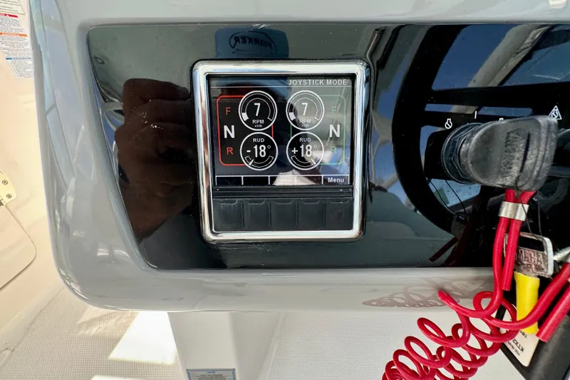 Slide: The Image of Control panel of 2019 Robalo R317 Dual Console boat with joystick mode display. - 37