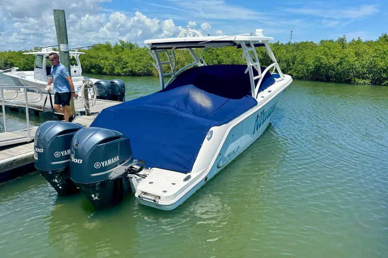 Slide: The Image of 2019 Robalo R317 Dual Console boat docked with Yamaha engines. - 57