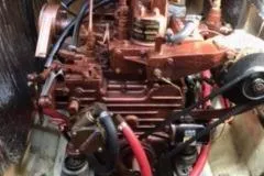 Slide: The Image of Engine of a 1977 Columbia 31 sailboat with visible components and wiring. - 14