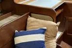 Slide: The Image of Interior of a 1977 Columbia 31 sailboat with cushions and wooden furnishings. - 9