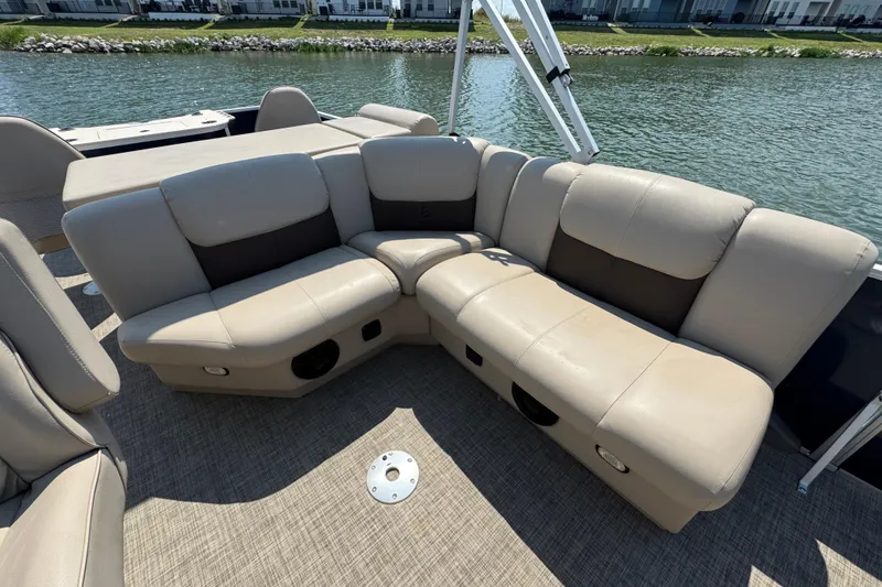 Slide: The Image of Luxurious seating on 2019 G3 X22FC boat, overlooking serene waterfront. - 22