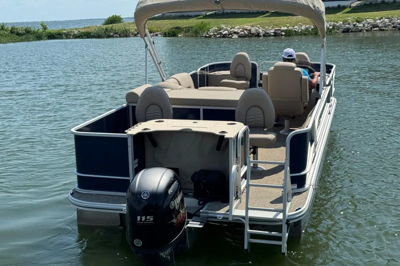 Slide: The Image of 2019 G3 X22FC pontoon boat on a lake with Yamaha 115 engine. - 4