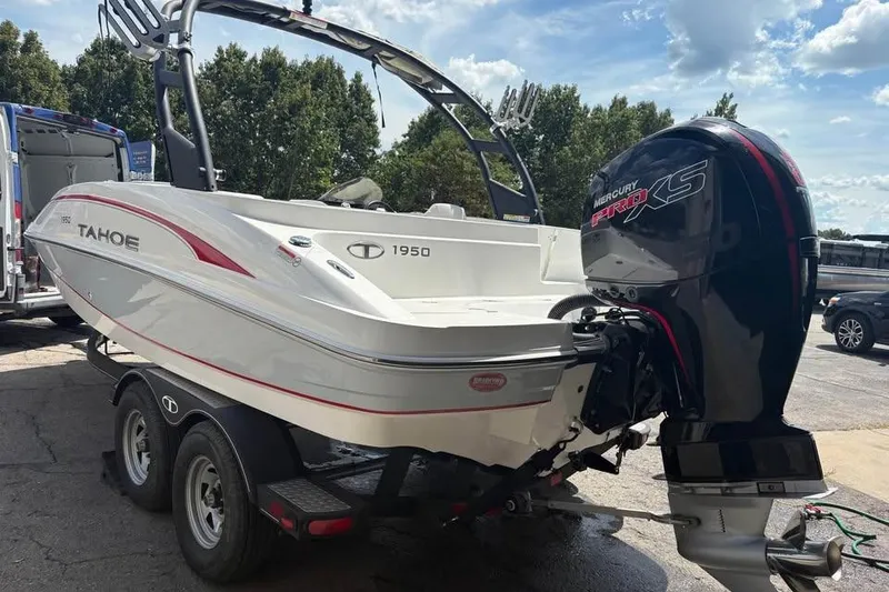 Slide: The Image of 2022 Tahoe 1950 boat with Mercury Pro XS engine on trailer, outdoors. - 3