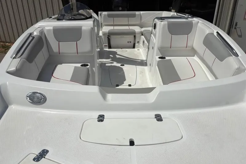 Slide: The Image of 2022 Tahoe 1950 boat interior with white seating and red accents. - 7
