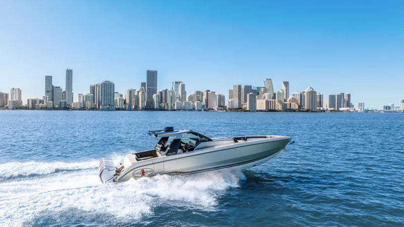 Slide: The Image of 2022 Cigarette 42 Auroris speedboat cruising near city skyline on a sunny day. - 10