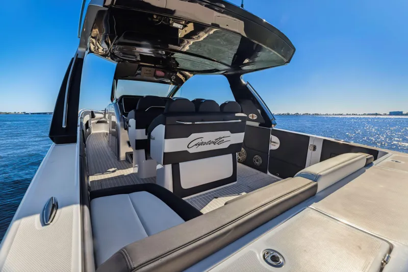 Slide: The Image of 2022 Cigarette 42 Auroris luxury boat interior with sleek seating on open water. - 17