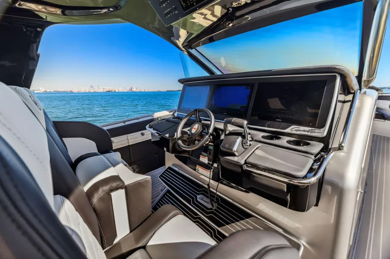 Slide: The Image of Interior of 2022 Cigarette 42 Auroris boat with modern dashboard and steering wheel. - 19