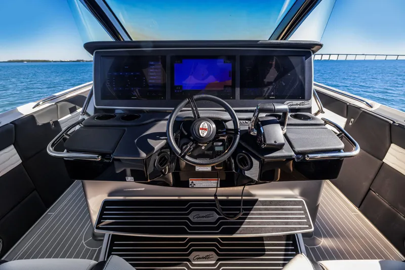 Slide: The Image of Cockpit of 2022 Cigarette 42 Auroris boat with advanced navigation system and steering wheel. - 20