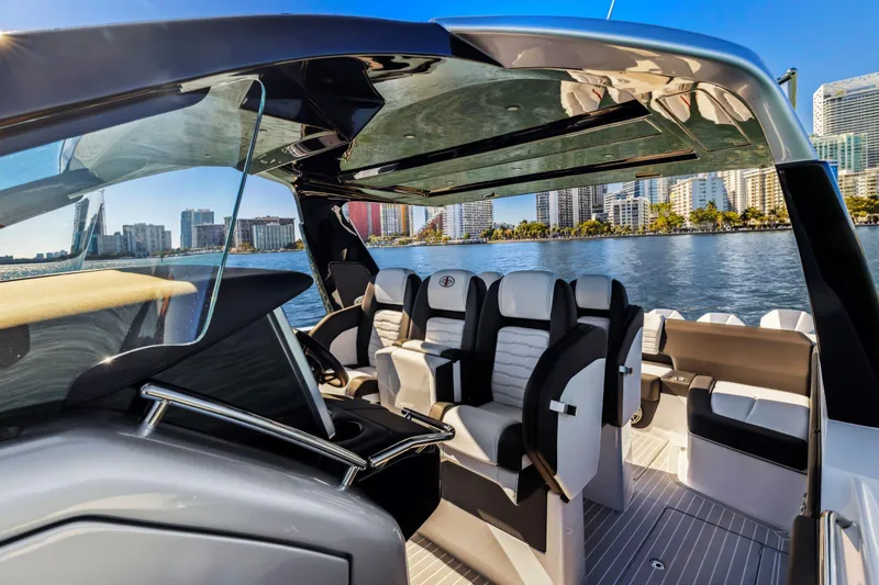 Slide: The Image of 2022 Cigarette 42 Auroris luxury boat interior with city skyline in the background. - 21