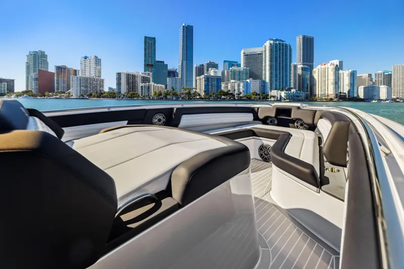 Slide: The Image of 2022 Cigarette 42 Auroris boat with city skyline in the background. - 26