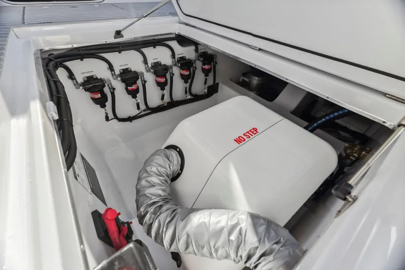 Slide: The Image of Engine compartment of 2022 Cigarette 42 Auroris boat, featuring "No Step" warning. - 29