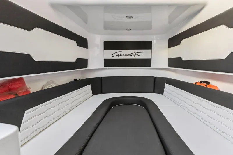 Slide: The Image of Interior of 2022 Cigarette 42 Auroris boat, featuring sleek black and white seating. - 33