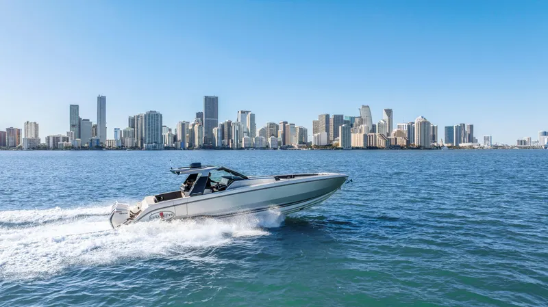 Slide: The Image of 2022 Cigarette 42 Auroris boat cruising with city skyline in the background. - 8