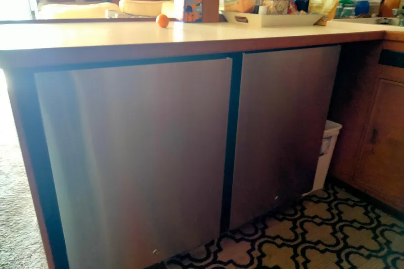 Slide: The Image of 1985 50' Pacifica Long Range Sportfisherman interior with modern kitchen cabinetry. - 17