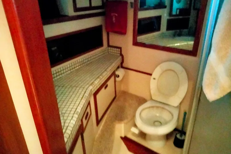 Slide: The Image of Bathroom interior of 1985 50' Pacifica Long Range Sportfisherman, featuring toilet and counter. - 19