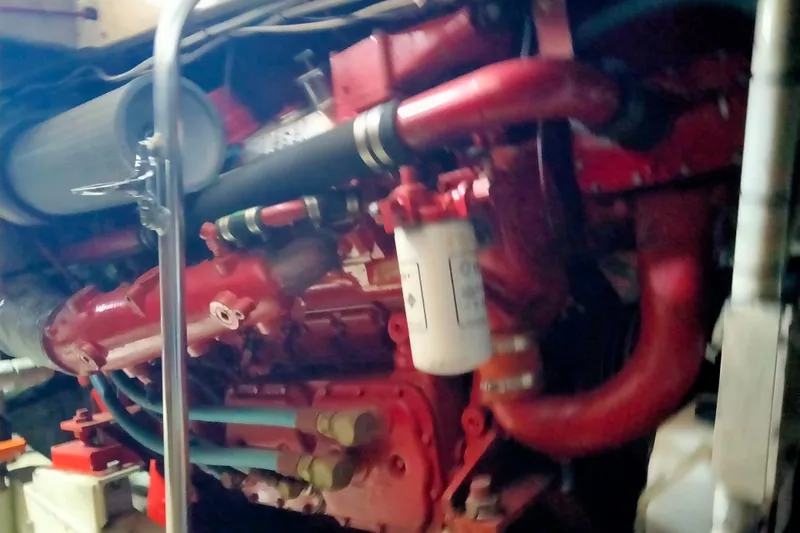 Slide: The Image of Engine room of a 1985 50' Pacifica Long Range Sportfisherman, featuring red engine components. - 24