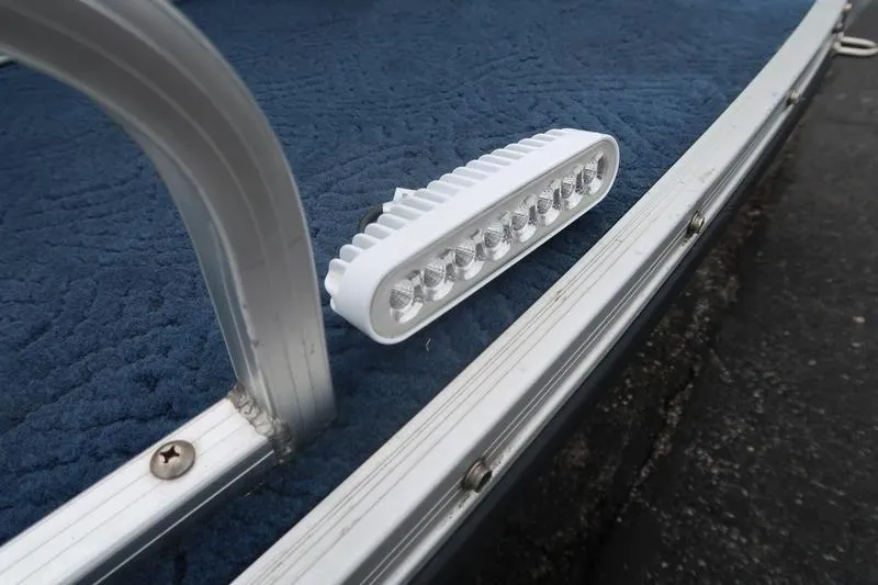 Slide: The Image of LED light on a 2002 Lowe Trinadad 200 boat with blue carpet. - 16