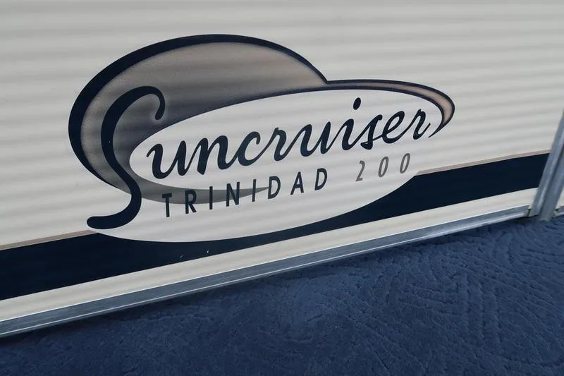 Slide: The Image of Suncruiser Trinidad 200 logo on Lowe boat, 2002 model, close-up view. - 21
