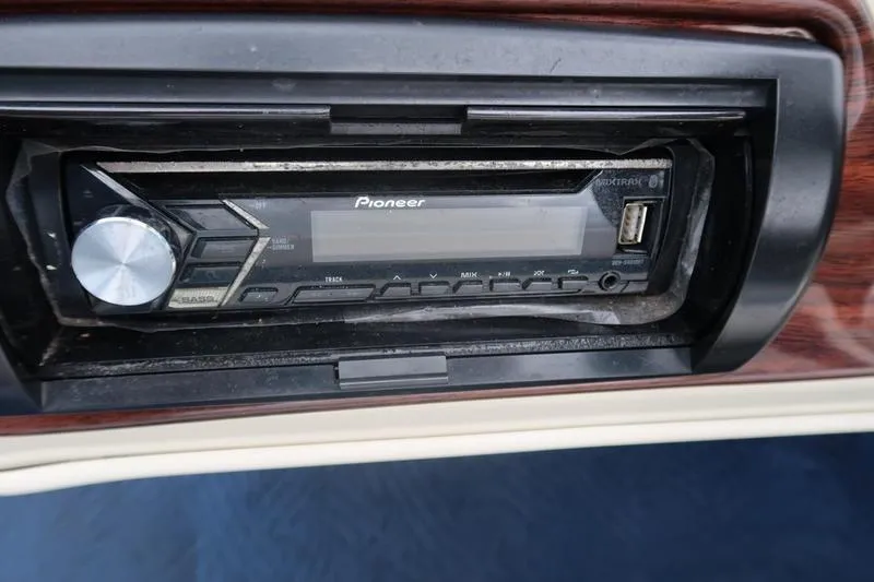 Slide: The Image of Pioneer stereo system in a 2002 Lowe Trinadad 200 boat dashboard. - 24