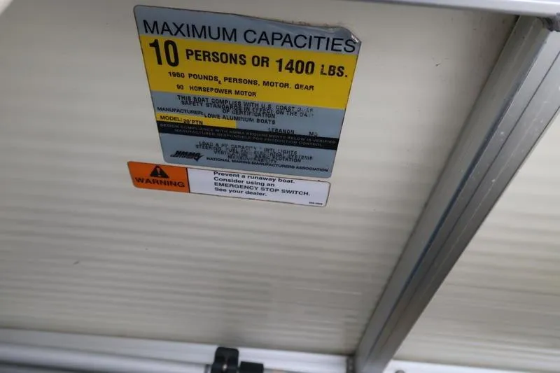 Slide: The Image of Capacity label on Lowe Trinidad 200 boat, 2002 model, showing 10-person or 1400 lbs limit. - 26