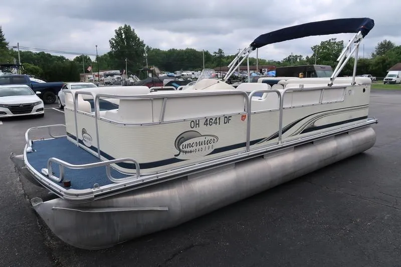 Slide: The Image of Pontoon boat, Lowe Trinidad 200, 2002 model, parked on asphalt with overcast sky. - 5