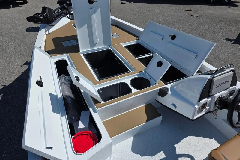 Slide: The Image of 2026 Xpress H20C Crappie boat interior with storage compartments and Garmin electronics. - 15