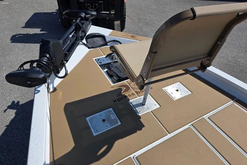 Slide: The Image of 2026 Xpress H20C Crappie boat deck with seat and Garmin trolling motor. - 18