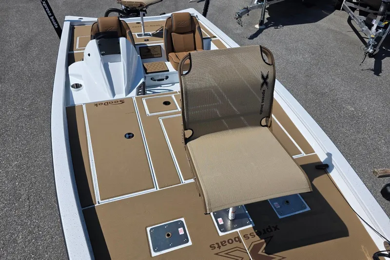 Slide: The Image of 2026 Xpress H20C Crappie boat with tan deck and seating, ideal for fishing. - 19