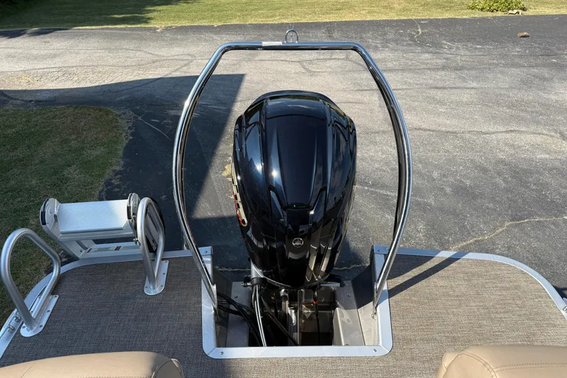 Slide: The Image of 2025 Bennington 23 LXSFB boat with sleek black outboard motor. - 13