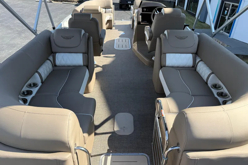 Slide: The Image of 2025 Bennington 23 LXSFB boat interior with luxurious beige seating and cup holders. - 14