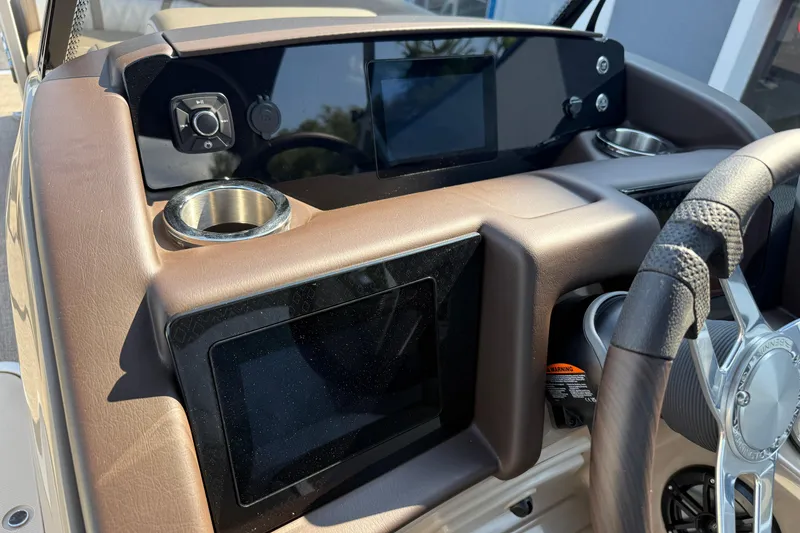 Slide: The Image of Dashboard of 2025 Bennington 23 LXSFB boat with modern controls and steering wheel. - 19