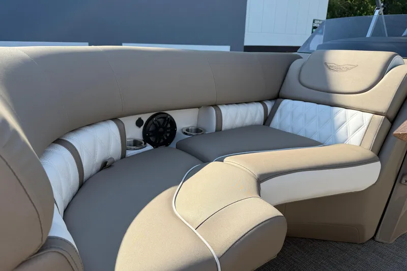 Slide: The Image of Luxurious seating on 2025 Bennington 23 LXSFB boat, featuring beige and white upholstery. - 26