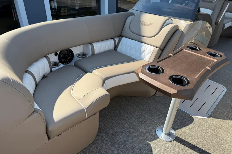 Slide: The Image of Luxurious seating area on 2025 Bennington 23 LXSFB boat with cup holders and speaker. - 27