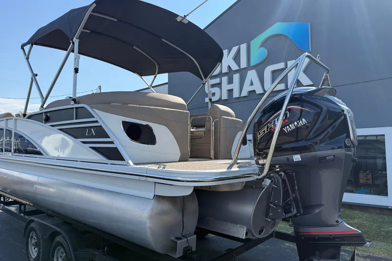 Slide: The Image of 2025 Bennington 23 LXSFB pontoon boat with Yamaha engine at Ski Shack dealership. - 8