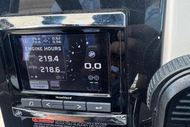 Slide: The Image of Dashboard of a 2016 Sea Ray 350 SLX showing engine hours and system status. - 16