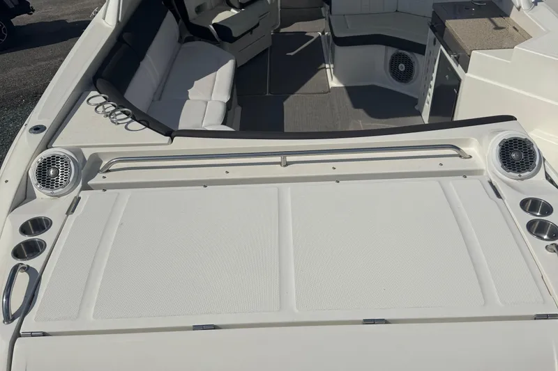 Slide: The Image of 2016 Sea Ray 350 SLX boat interior with seating and speakers. - 18