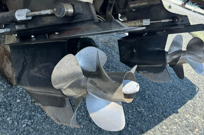 Slide: The Image of Close-up of 2016 Sea Ray 350 SLX boat propellers on gravel surface. - 3