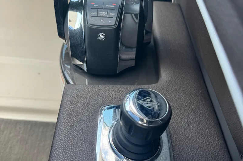 Slide: The Image of Close-up of 2016 Sea Ray 350 SLX boat controls, featuring throttle and joystick. - 4